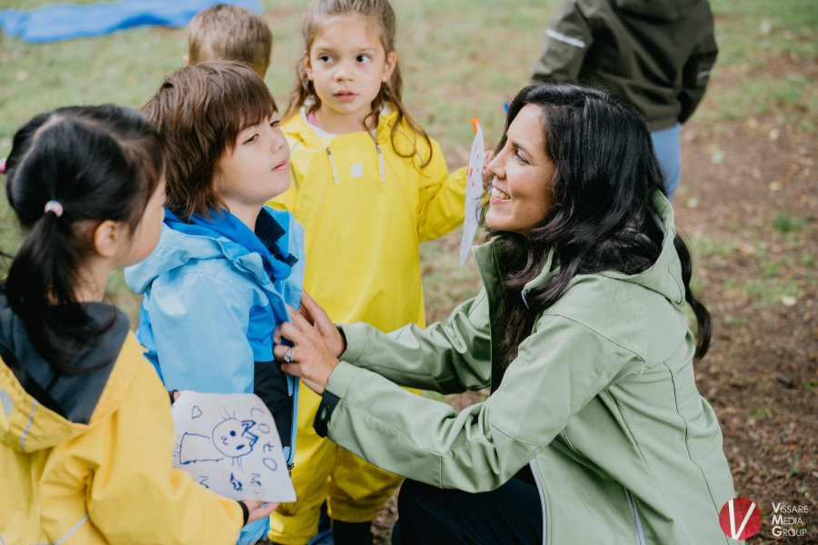 Educator engaging with children outdoors